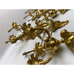 Pair of 19th century and later ormolu wall sconces, each modelled as an Atlas figure stood upon a curved bracket with acanthus support, supporting a plain globe with three scrolling branches with beaded sockets above foliate drip pans, and further conforming socket and drip pan, H67cm