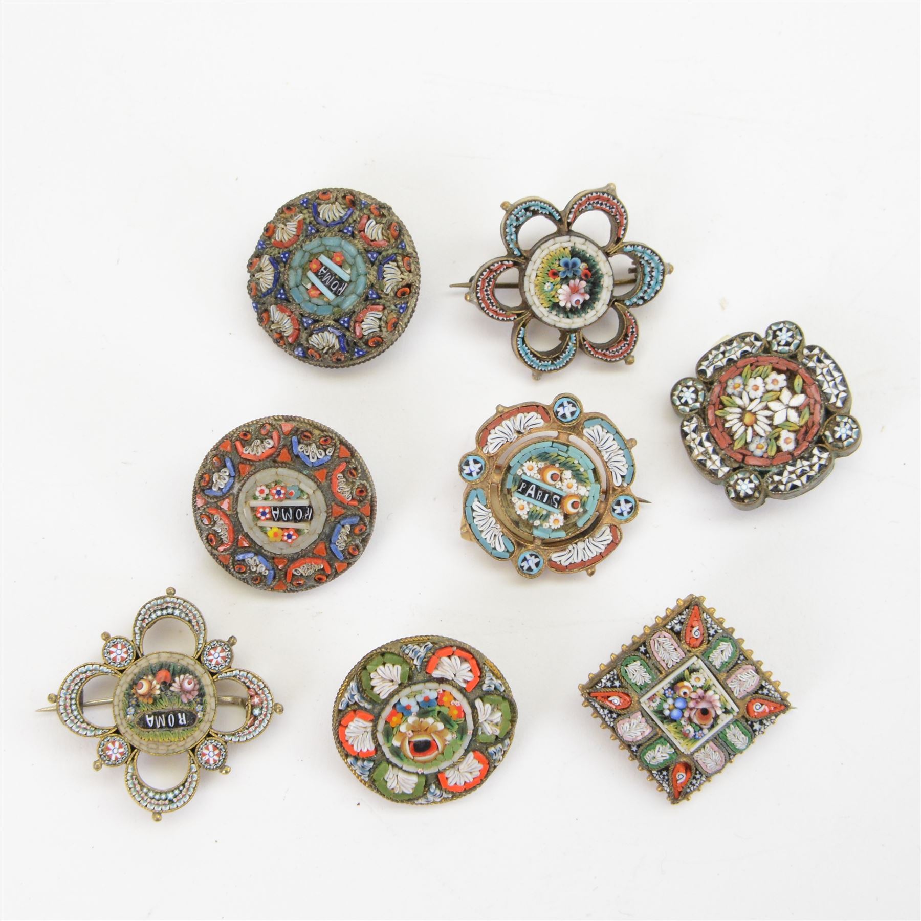 Thirty micro mosaic brooches including four Roma examples, a Paris and Geneve example