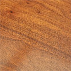 Regency design mahogany extending twin pedestal dining table with two additional leaves, raised on splayed supports terminating brass paw feet
Extends to 268cm