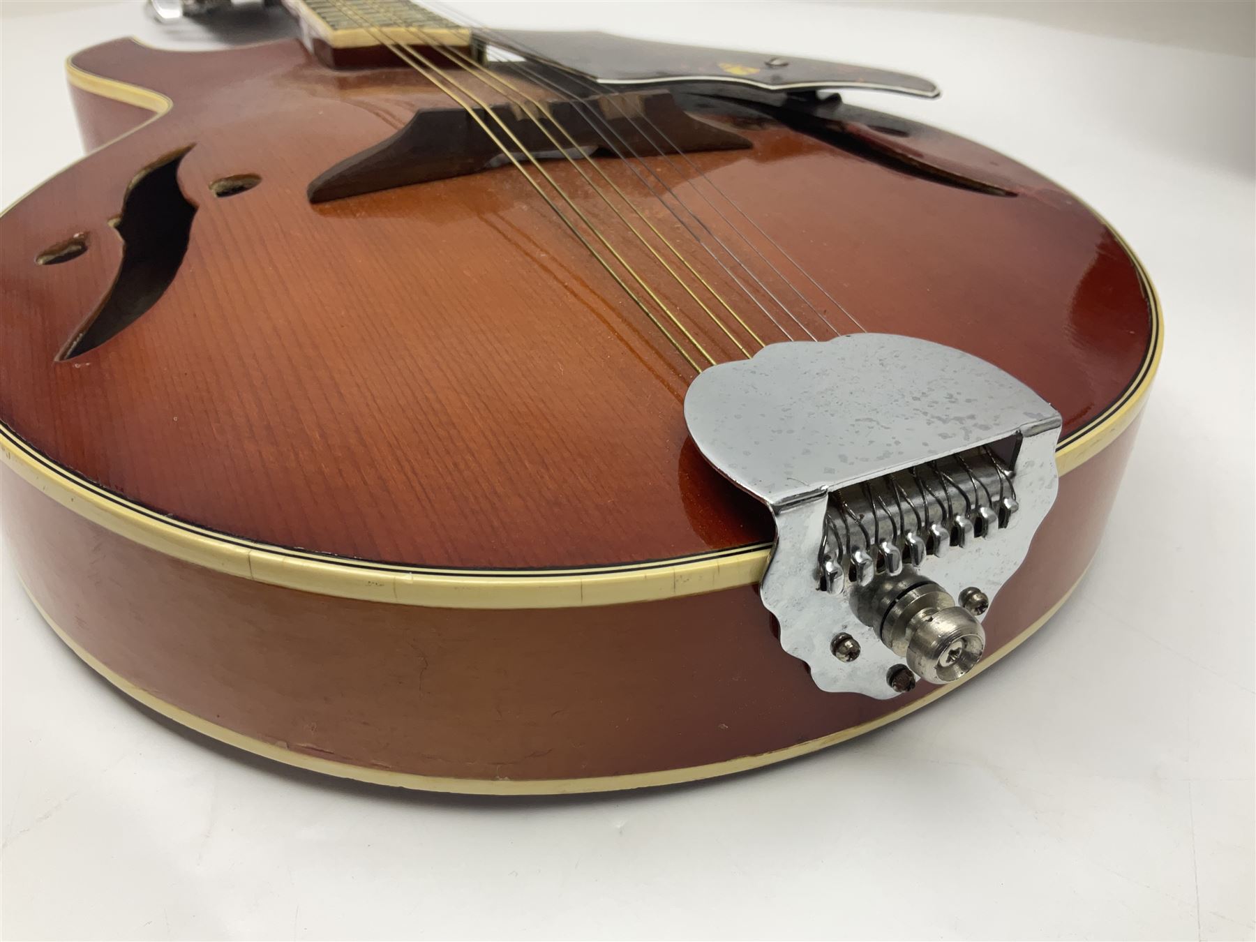 Eastern eight-string mandolin with sunburst finish and mother-of-pearl inlay L68.5cm; and another Harmony mandolin with cracked headstock (2)