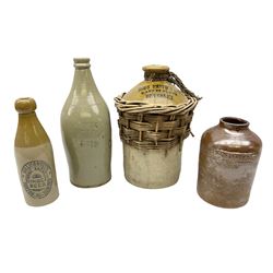 19th century stoneware gin bottle impressed I. Peck, Spirit Merchant Hull H27cm, Victorian salt glazed stoneware jar embossed W. Jefferson Mustard Manufacturer 47 Wincolmlee Hull, part cane covered stoneware flagon for John Smith Market Place Beverley and a Barton-on-Humber stoneware ginger beer bottle (4)  