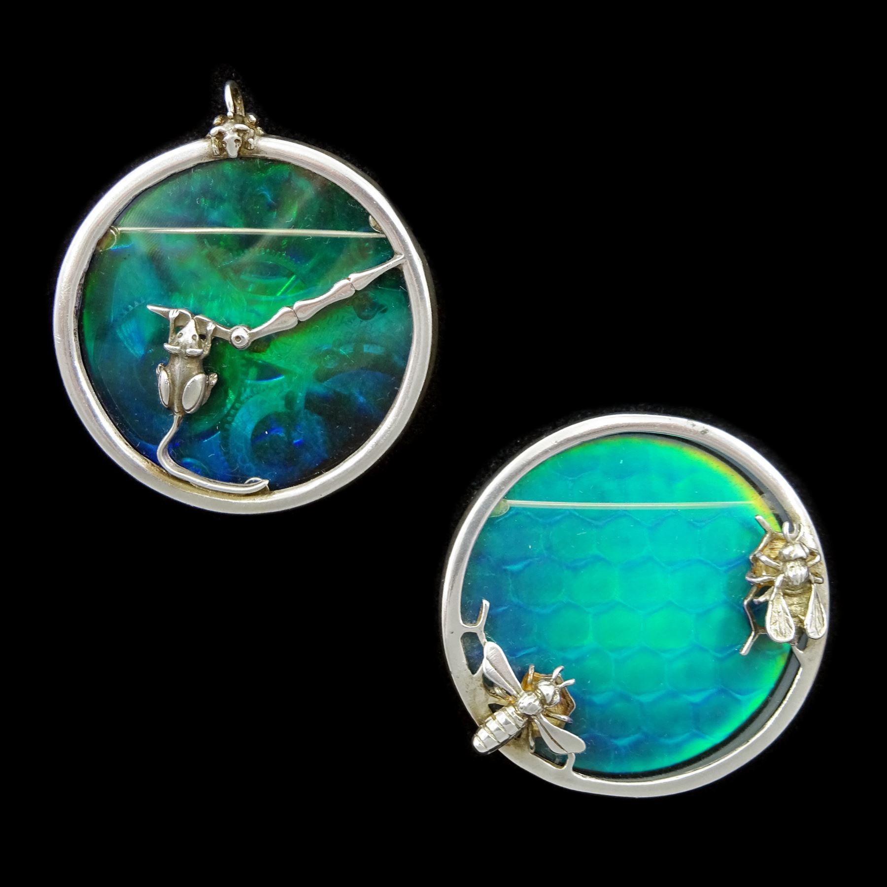 Two Alastair Norman Grant silver and holographic glass brooches one depicting mice playing on a clock face the other bees around a hive Edinburgh 1987 and 1988 Jewellery Watches