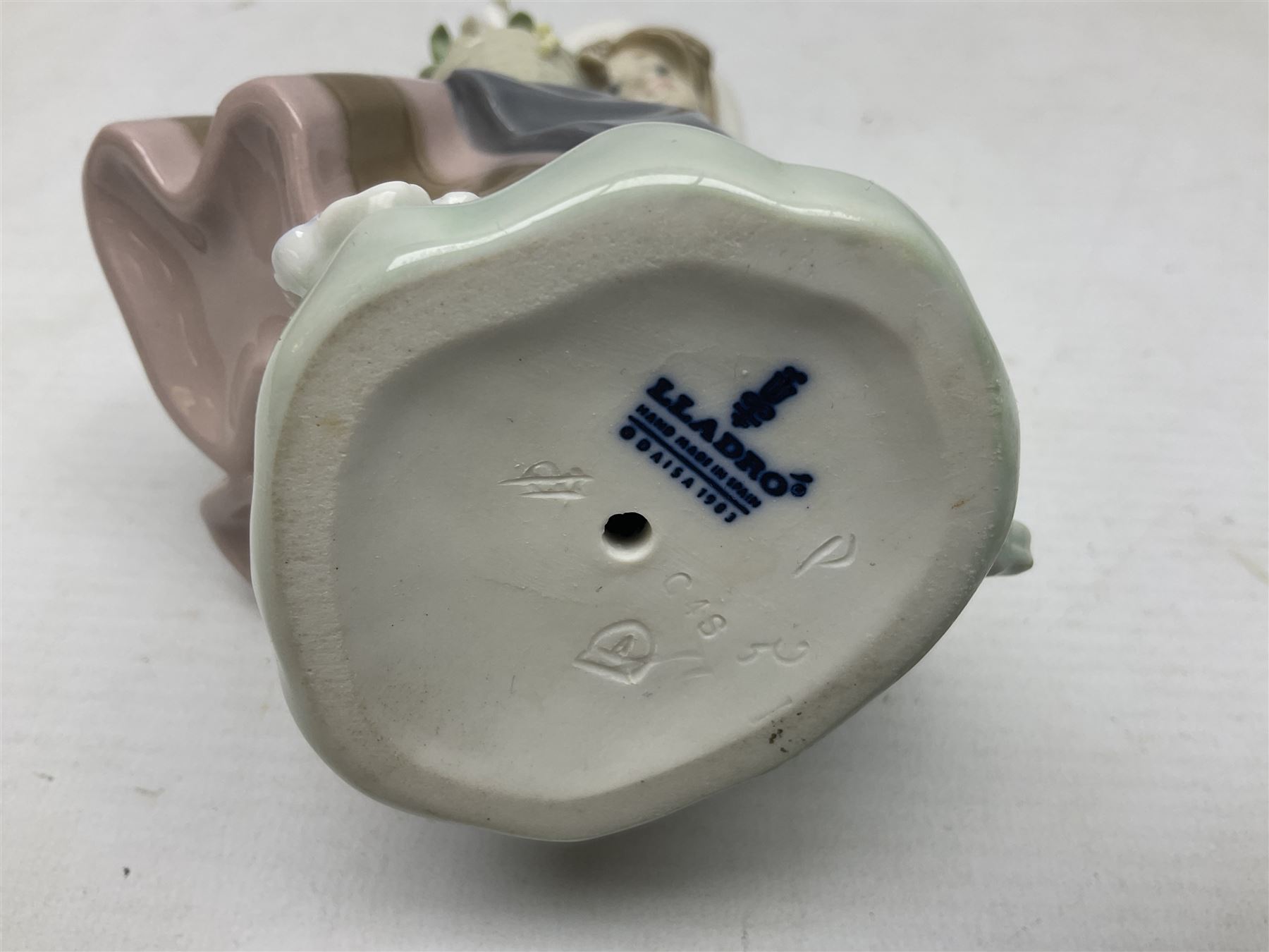 Three Lladro Flower Girls figures, comprising Sweet Scent no 5221, Pretty Pickings no 5222 and Spring is Here no 5223, largest example H18cm 