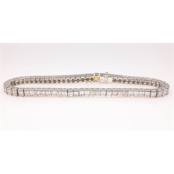  Platinum emerald cut diamond bracelet stamped 950, the flexible line of sixty-eight diamonds approx 6.3 carat  