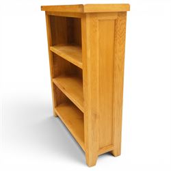 Contemporary solid oak open bookcase, rectangular top over three shelves, on chamfered square feet