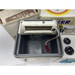Six toy kitchen appliances - Casdon battery operated cooker; Mettoy Hoover washer; Chad Valley Hoovermatic washer; Wells Brimtoy tin-plate clockwork washer; and two Morphy Richards irons; together with a continental child's Regina sewing machine; all boxed (7)