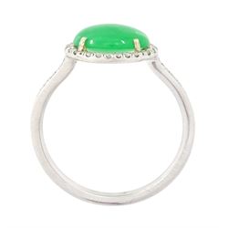 Platinum jadeite and diamond cluster ring, single oval cabochon cut jadeite of 2.20 carat, surrounded by round brilliant cut diamonds and diamond set shoulders, stamped Plat