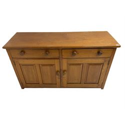 JAS Brister & Co Ld - Mid-20th century teak sideboard, fitted with two drawers over two panelled cupboards, stamped 'JAS. Brister & Co Ltd., Complete House Furniture, Port Elizabeth'