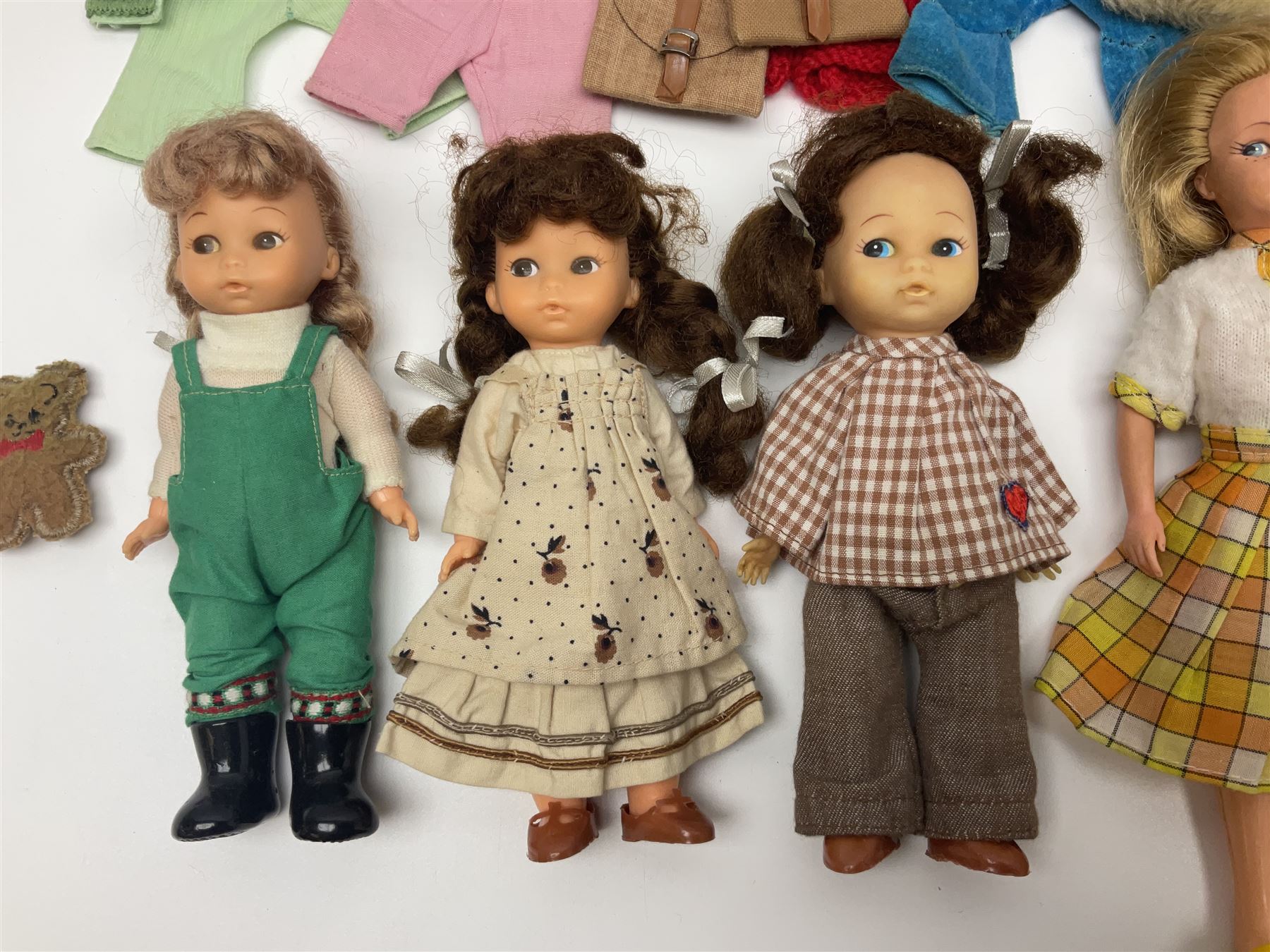 Six fashion dolls by Amanda Jane, Sindy and Barbie with various outfits, clothing and footwear