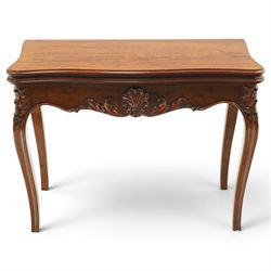 Victorian carved mahogany card table, shaped rectangular top with hinged fold-over top enc...