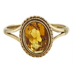 9ct gold oval citrine ring with rope twist surround, Birmingham 1983