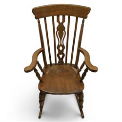 Farmhouse elm rocking chair, high back with 'Fleur De Lis' splat, shaped arms above turned supports, on rocker base 