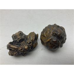 Eight netsuke, modelled as skulls, dragons and mythical beasts 