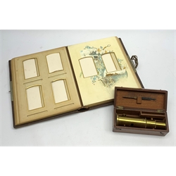 Late Victorian student's brass monocular field microscope H15cm in fitted mahogany box with tweezers; and Victorian unstocked embossed leather bound photograph album with metal clasp (2)