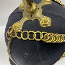 Post-1902 Welsh Regiment Officer's Home Service Blue Cloth Helmet with gilt metal King's crown helmet plate to the front, a removable spike to the top on a shaped cruciform base with rosette fittings, rosette side bosses, brass trim to the front peak, and leather and velvet backed chin scales, with sweat band, the interior with the remains of a makers label at the address 1,3 & 5 Lexington Street, Golden ? London W (presumably Hobson & Sons)
