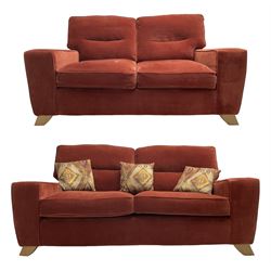 Two-seat sofa (W175cm, H95cm, D100cm), and matching three-seat sofa (W200cm), upholstered in dark burnt orange fabric with scatter cushions 