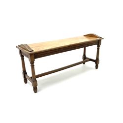 Early 20th century oak hall bench, turned supports joined by ‘H’ stretcher