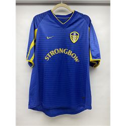 Fourteen items of replica sporting clothing including Leeds United football club shirts, England jerseys etc