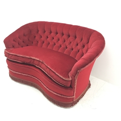 Early 20th Century kidney shaped two sofa upholstered in deep buttoned red fabric, W147cm