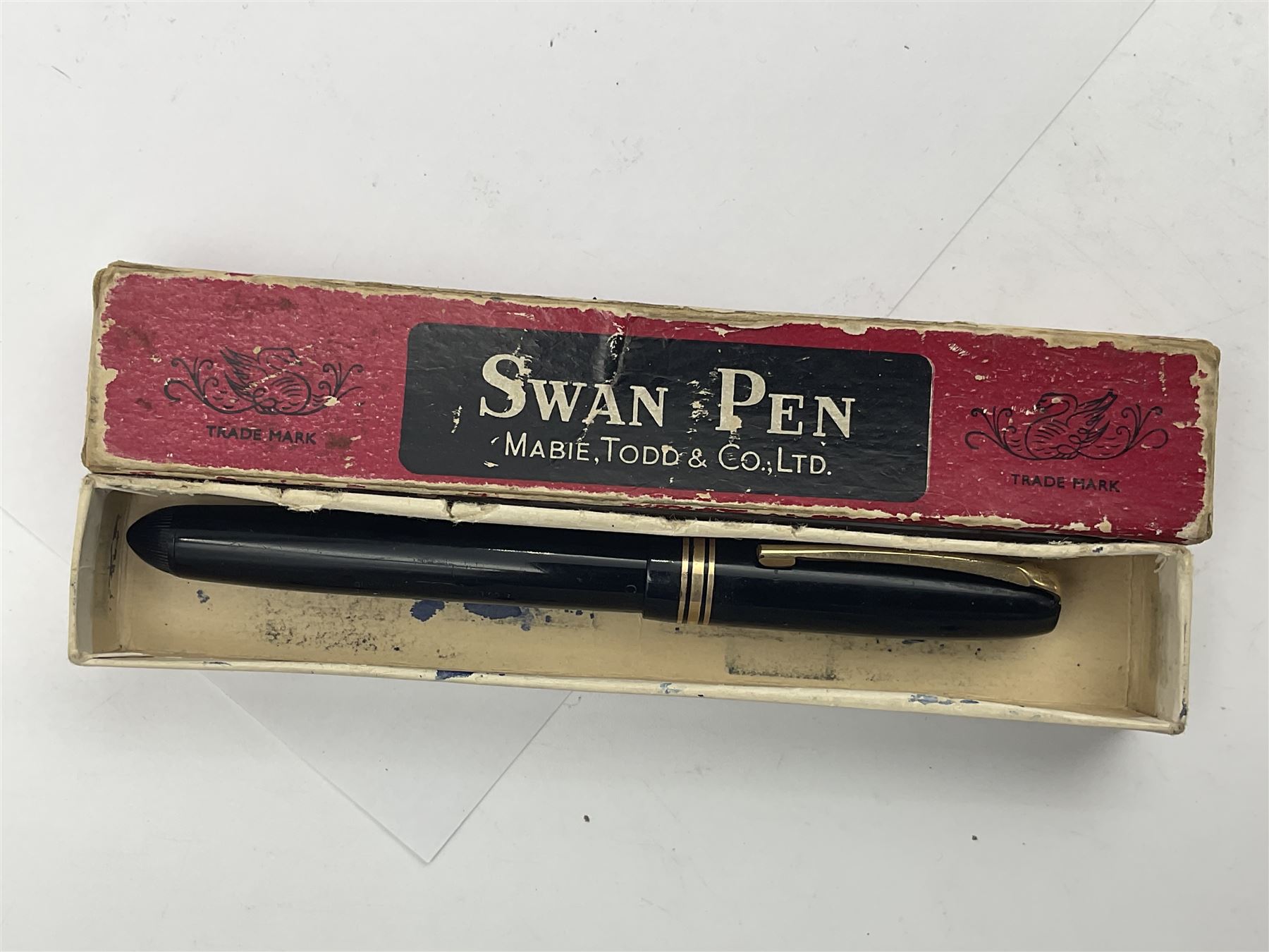 Three Swan Mabie Todd fountain pens, comprising Self Filler 3162 with black barrel and cap with single band and gold nib stamped Eternal 1 14ct, together with two Calligraph examples with gold nibs stamped 14ct, one with box, largest L12.5cm
