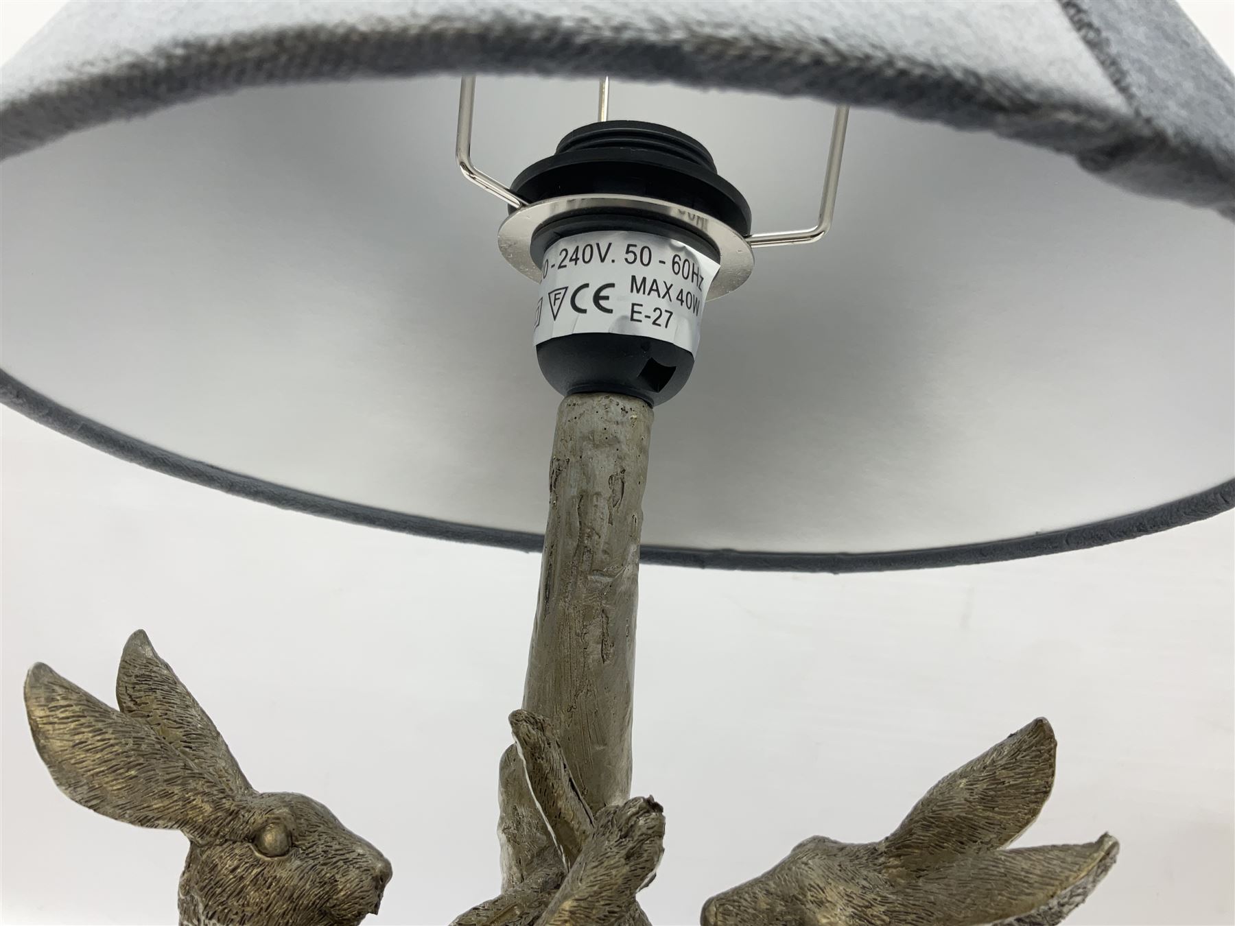 Silver composite table lamp, modelled as a pair of boxing hares, with a grey velvet shade, H45cm