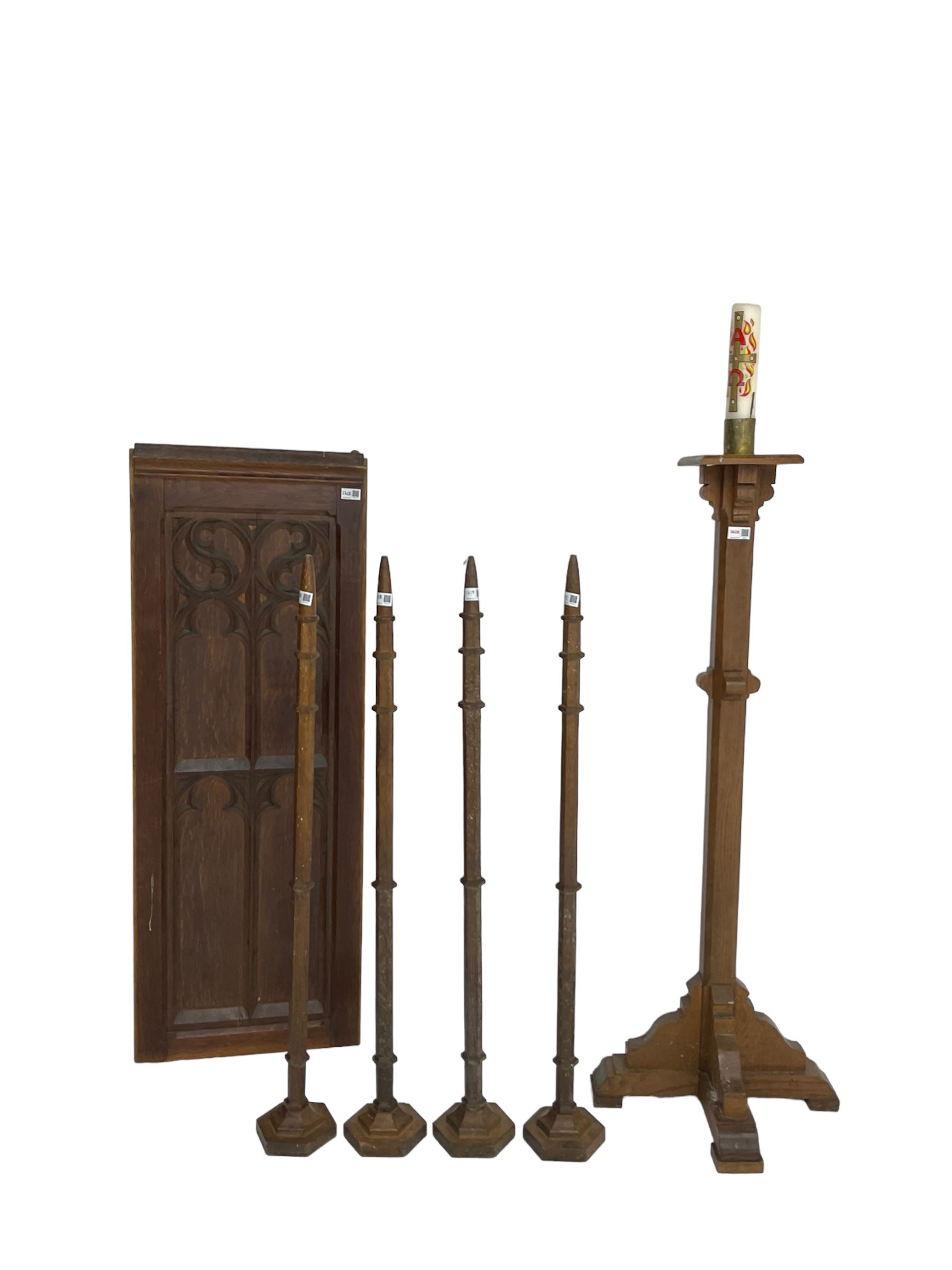 Ecclesiastical oak torchere candle stand; Small panelled oak door with foliate arch applied moulding; set four oak church spokes