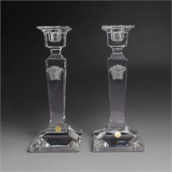 Rosenthal Versace pair of glass candlesticks, of square form, with candles and in original...