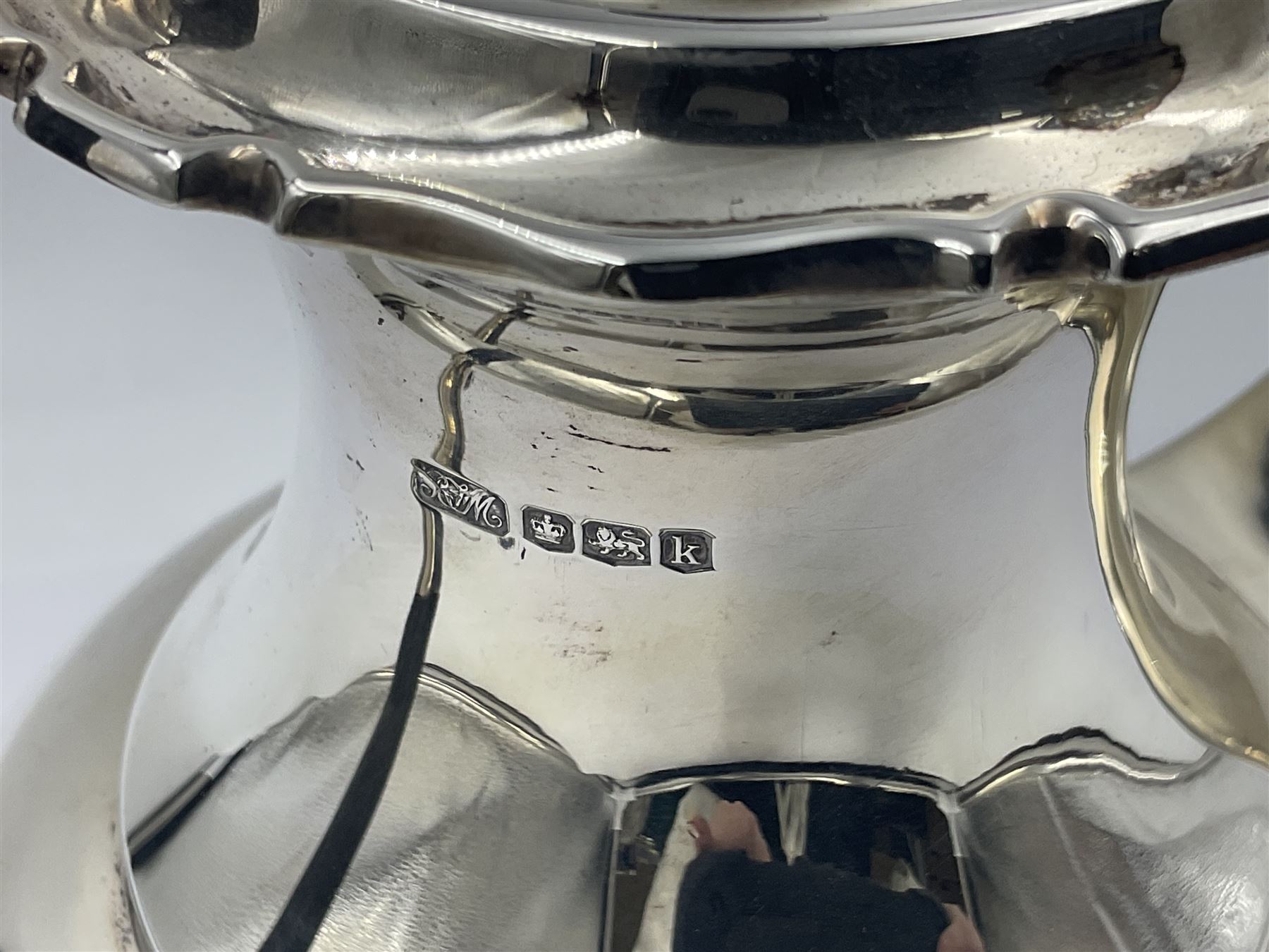 1920s five-piece silver tea service, comprising teapot, coffee pot, hot water pot, twin handled open sucrier and milk jug, each of squat circular form with shaped rim, the teapot, coffee pot and hot water pot each with ebonised handle and finial, the sucrier and milk jug with acanthus capped scroll handles, all upon circular foot, hallmarked R F Mosley & Co, Sheffield 1926 & 1927, tallest H24cm