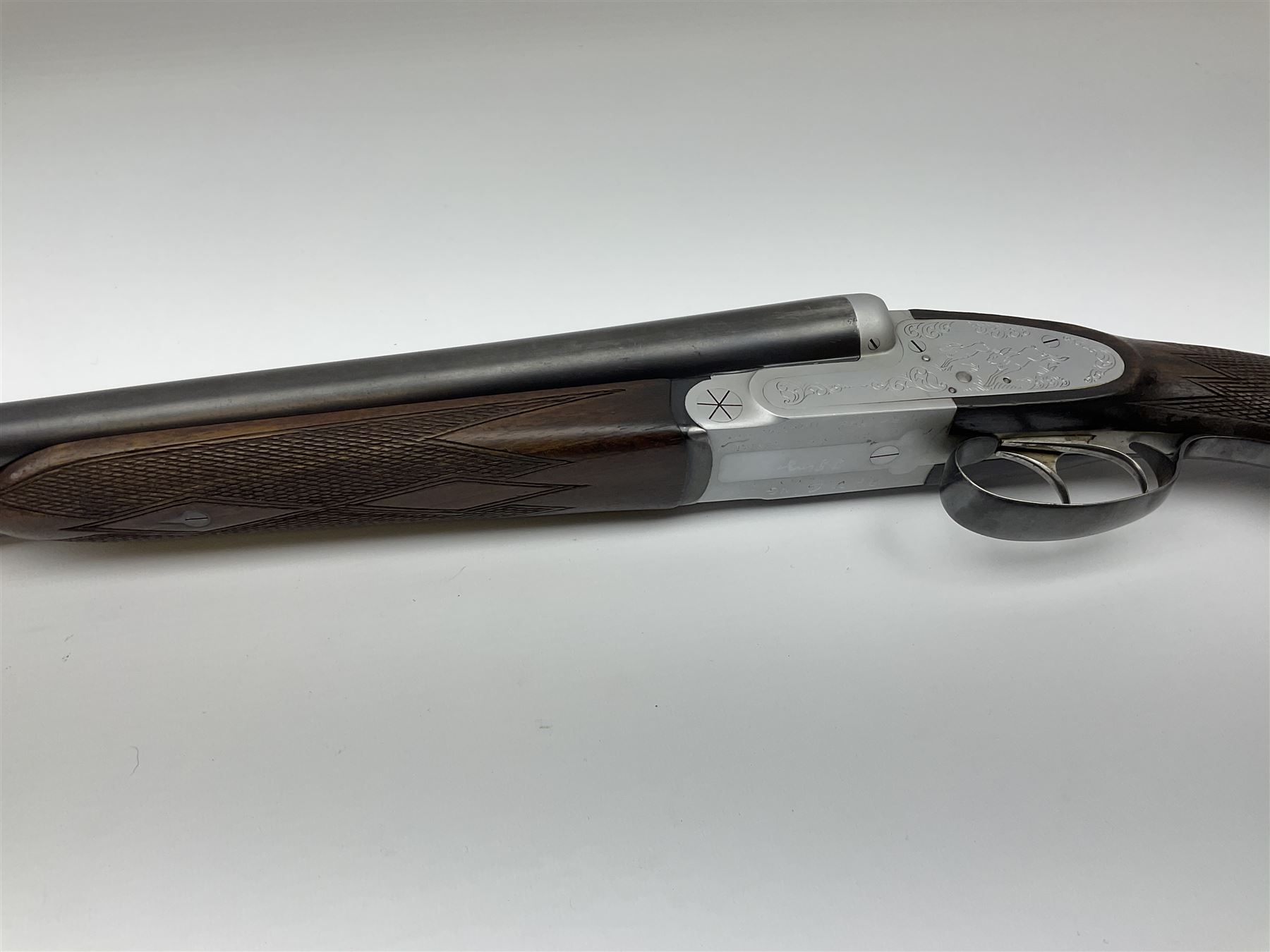Czechoslovakian BRNO 12-bore side-by-side double barrel sidelock non-ejector sporting gun with Poldi electroplating, the action crudely inscribed '24040544 Pte. J. Ging 1st Battalion Loyal Regiment 1965-1968 Malta G.C.', walnut stock with chequered pistol grip and fore-end and thumb safety, one sling swivel, serial no.5199866, L114.5cm overall RFD ONLY AS LACKING VISIBLE PROOF MARKS