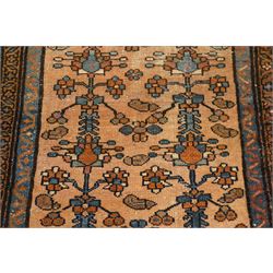 Collection of four Persian rugs, comprising a Saraband ivory ground rug with all-over boteh field and multiple borders; a crimson ground Hamadan type rug with all-over stylised floral and geometric motifs; a floral medallion prayer rug with dark field and ivory spandrels; and a Hamadan peach ground rug with repeating stylised flowering plants and dark multiple borders, largest 83cm x 142cm