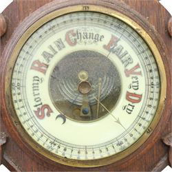 Victorian carved oak aneroid barometer, the foliate crest above a glazed thermometer, with scroll carved sides and circular dial below, H  60cm