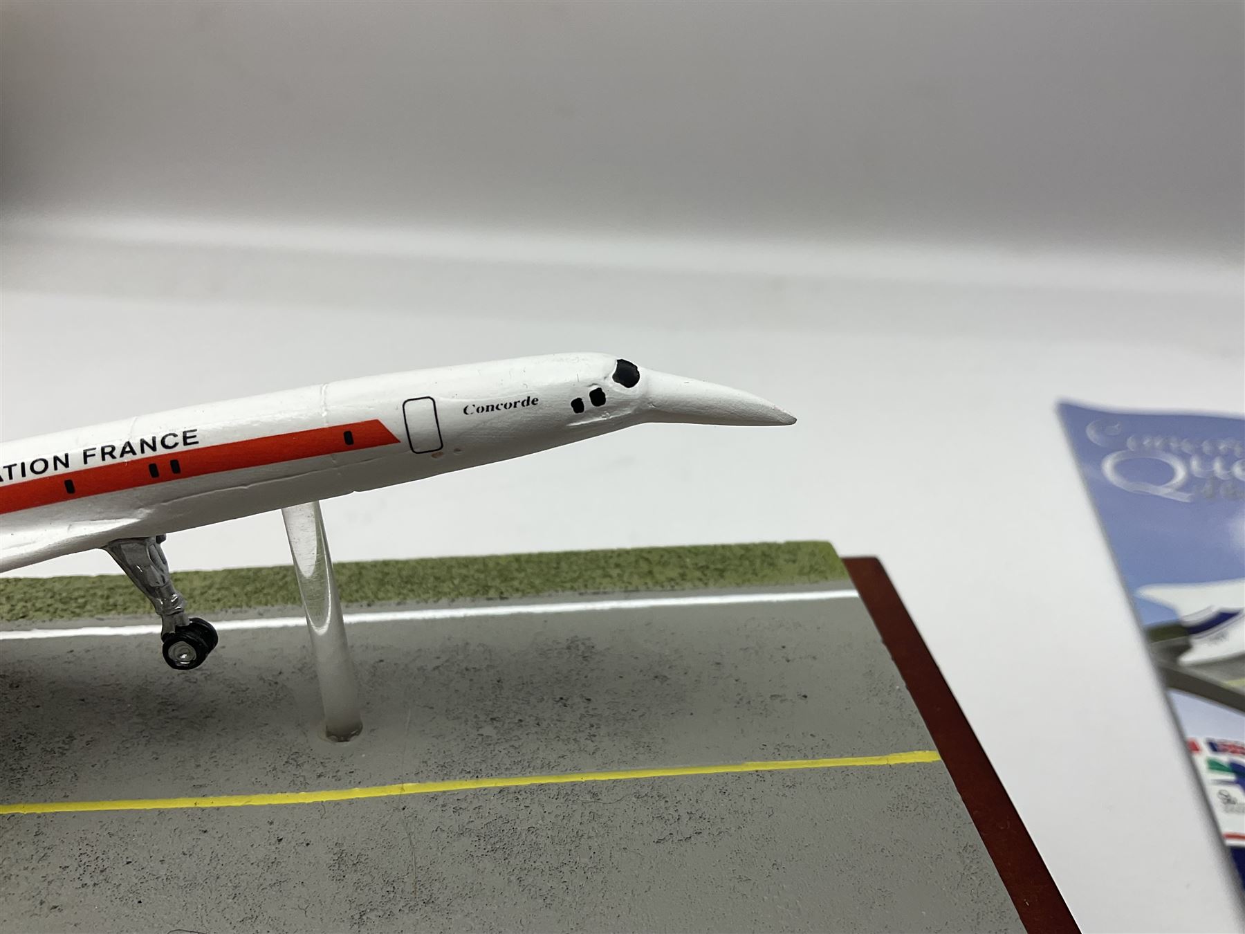 Danbury Mint 'The Ultimate James Bond Collection' comprising stamps and coins housed in a display case, 'Concorde Queen of the Skies' sculpture, stamps, medallion display and 2020 'Centenary of the Unknown Warrior' five pound coin cover in Harrington and Byrne folder