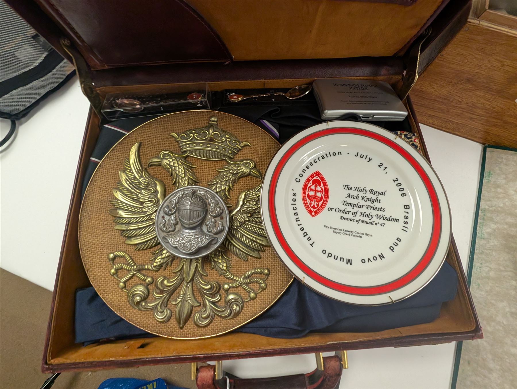 Collection of Masonic jewels and regalia, including robes, sashes, gloves, medallions, etc, in a number of briefcases and boxes