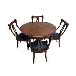 Regency style dining set - the table with circular tilt-top on turned and carved column, concaved triangular platform with three scroll carved feet, together with set four rope twist dining chairs with upholstered drop in seats