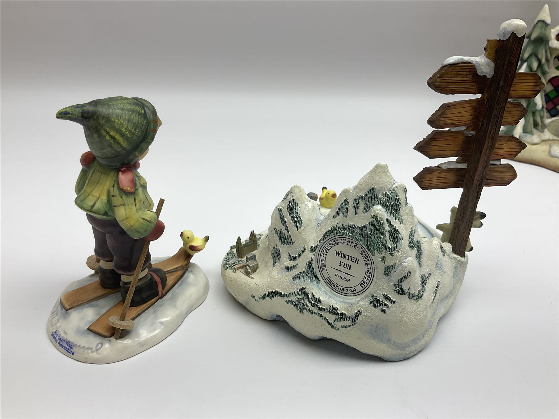 Eight Christmas Hummel figures by Goebel, to include Wintertime Chapel candle holder, Winter Fun, Christmas Morning, Christmas Time and Gingerbread Lane, tallest H21cm