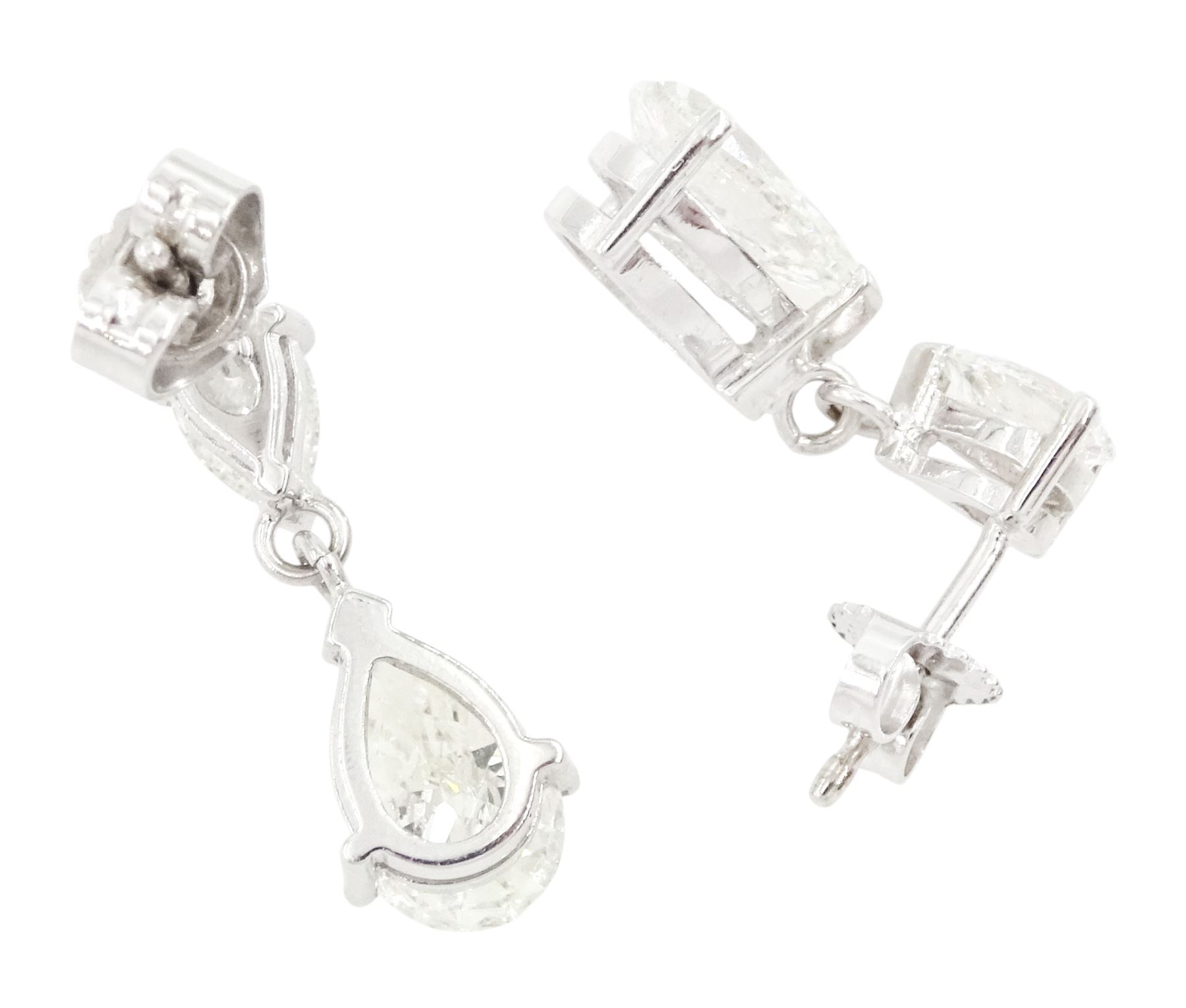 Pair of 18ct white gold two stone pear cut diamond pendant stud earrings, hallmarked, the two largest diamonds of approx 1.70 carat and 1.55 carat, total diamond weight approx 4.40 carat