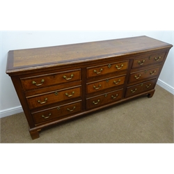  George III mahogany cross banded Lancashire oak dresser, moulded top above nine graduating drawers, brass swan necked handles, shaped bracket supports, W211cm, H98cm, D54cm   