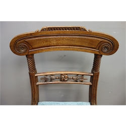  Set four Regency mahogany dining chairs, scrolled cresting rail carved with flower heads, rope twist uprights, carved middles rail, upholstered drop in seat, on moulded sabre legs  