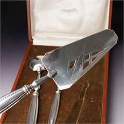 Scandinavian white metal three piece serving set comprising pastry slice, sauce ladle and sifting spoon with fluted handles, cased