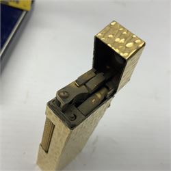 Dunhill gold plated lighter with textured bark effect decoration, in fitted case