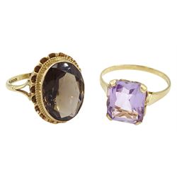 Gold single stone amethyst ring, with heart design gallery and a gold oval smokey quartz ring, both hallmarked 9ct