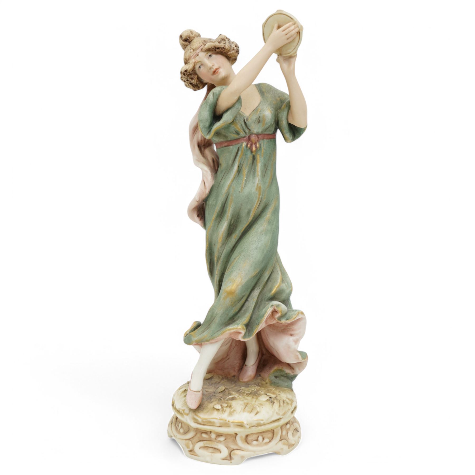 Royal Dux female figure holding a tambourine in burnished gilt and on circular naturalistic base, model no.1430 H27cm