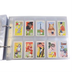 Collection of 1930s and later Football related trading and cigarette cards, including complete set of sixteen 1936 Topical Times Panel Portraits of Star Footballers, collection of further 1930s Footballer Panel Portraits, complete set of twenty-five 1955 The Wizard Famous Footballer cards, complete set of fifty Wills Association Footballers 1935, complete set of fifty Godfrey Phillips International Caps cards, etc, housed in three albums