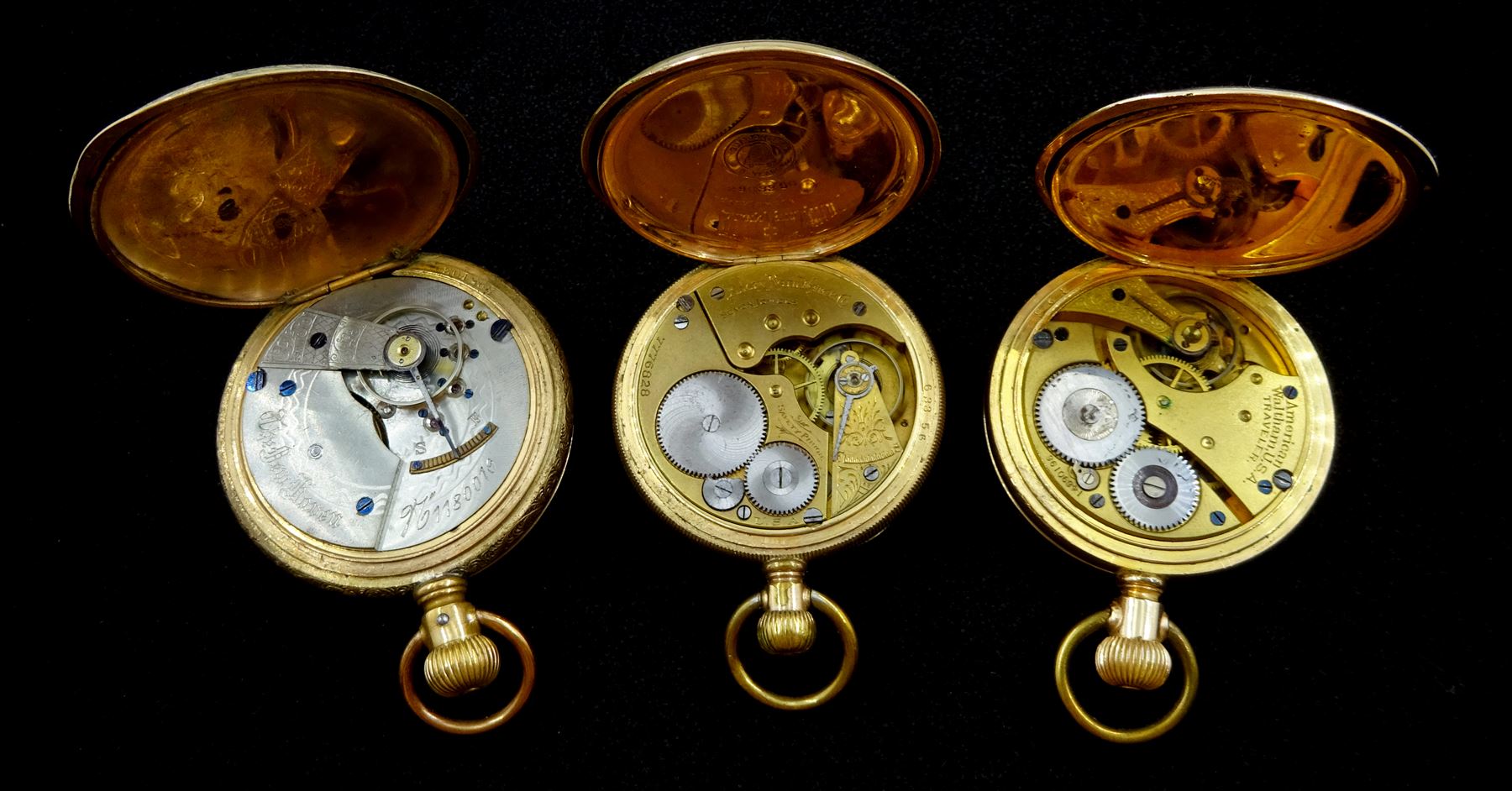 Three American gold-plated pockets including full hunter keyless Traveller pocket watch by Waltham, No. 14690196, full hunter by The New Haven, No. 1180019 and an open face by Elgin, all white enamel dials with Roman numerals