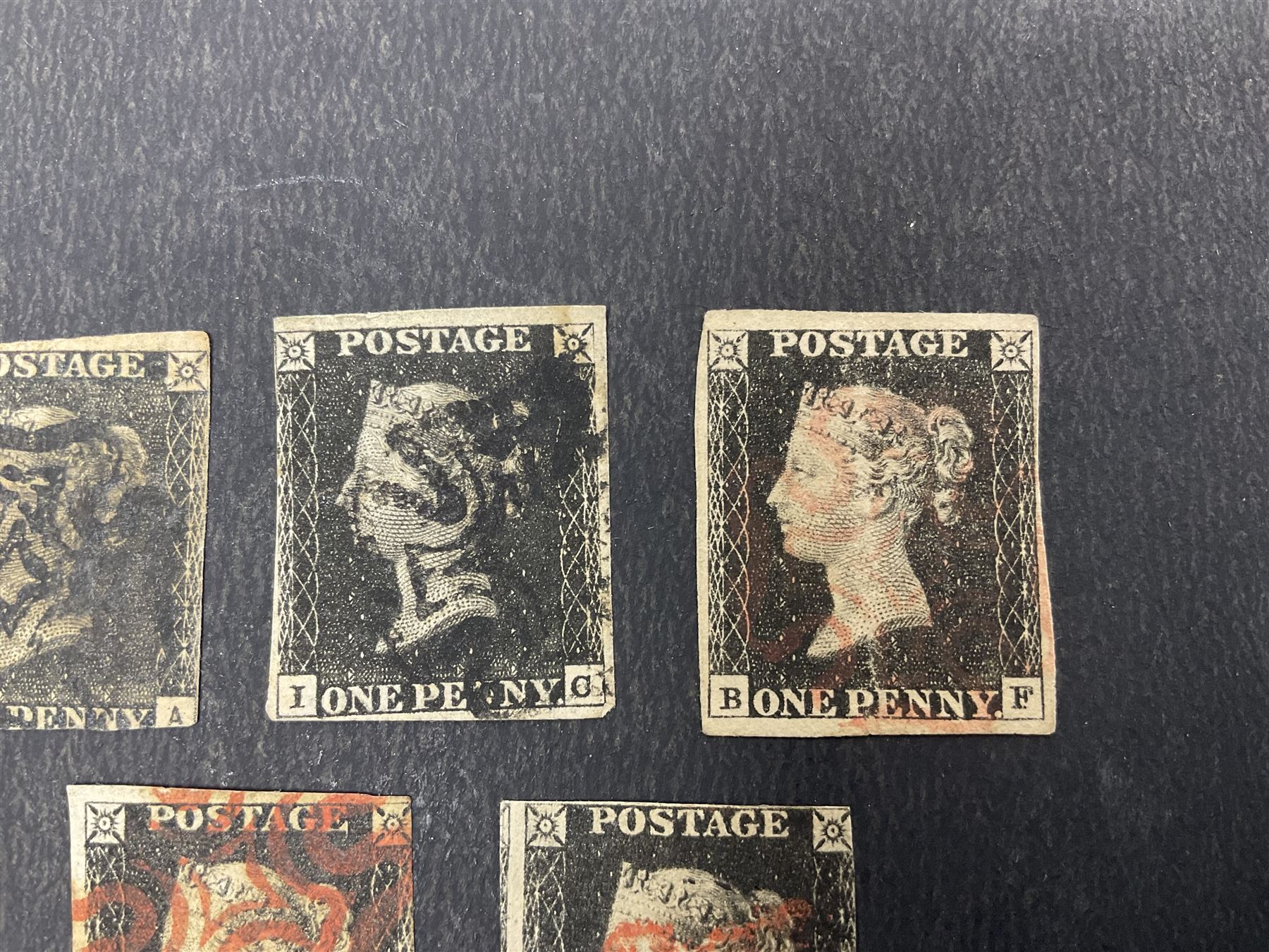 Seven Great Britain Queen Victoria penny black stamps, three with black and four with red MX cancels