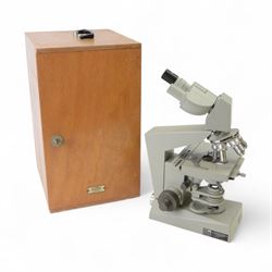 Three microscopes, including Griffin Student Vernier Microscope, Vickers Instruments binocular microscope with Leitz Wetzlar Periplan 10x lenses, and a Carl Zeiss Jena binocular microscope in a wooden Olympus Tokyo box