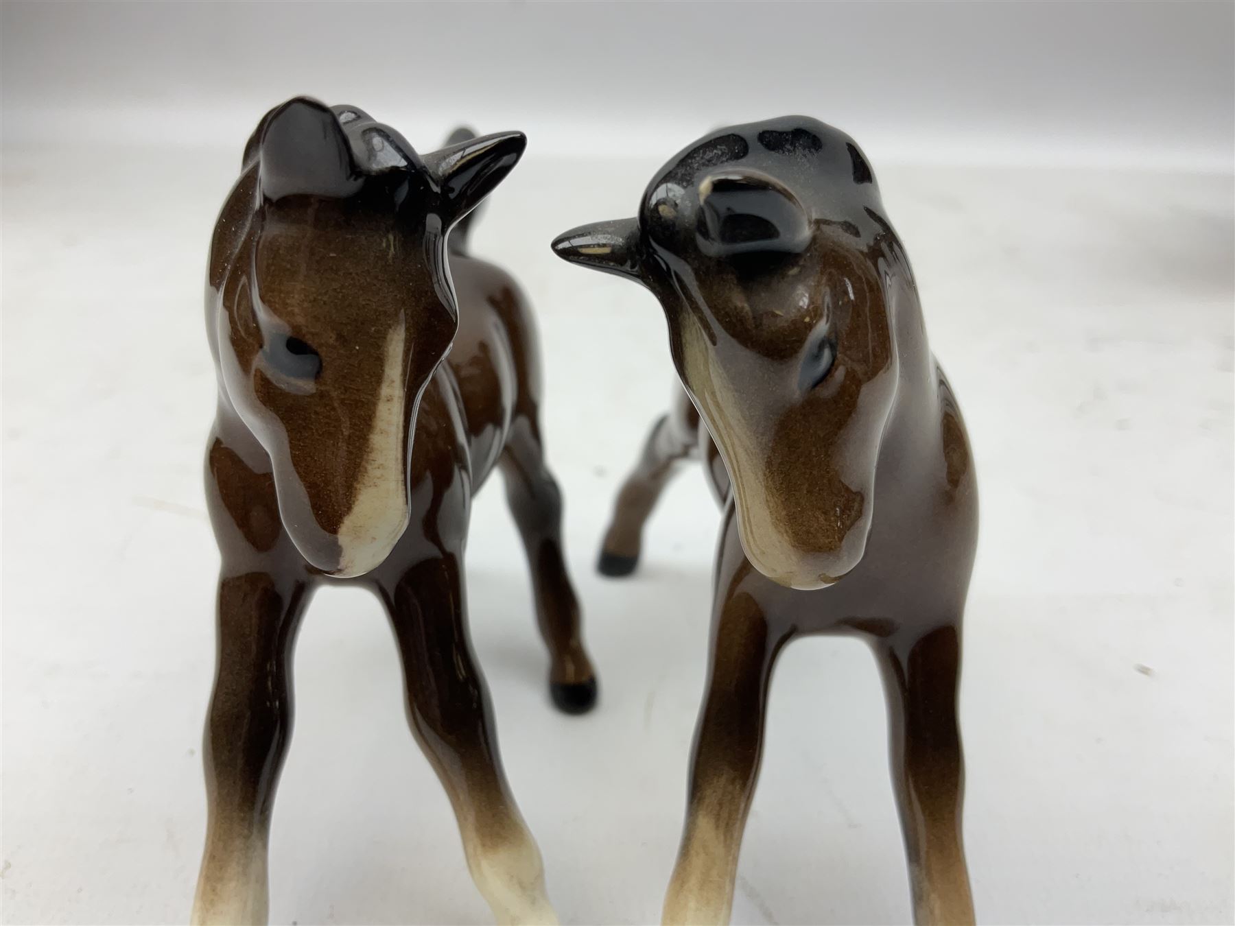 Six Beswick figures of bay horses, including large hunter no.1734, Shire horse no.818, horse with tucked head no.1549, etc (6)