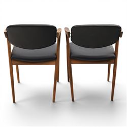 Kai Kristiansen (Danish c.1929-2022) - Pair of mid-20th century teak elbow chairs upholstered in black leatherette