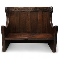 Mouseman - circa. 1920s adzed oak settle or bench, the cresting rail carved with inscription 'Before Honour is Humility', four panel back and plank seat on shaped end supports carved with grotesque masks terminals, carved with mouse signature, by Robert Thompson of Kilburn 
