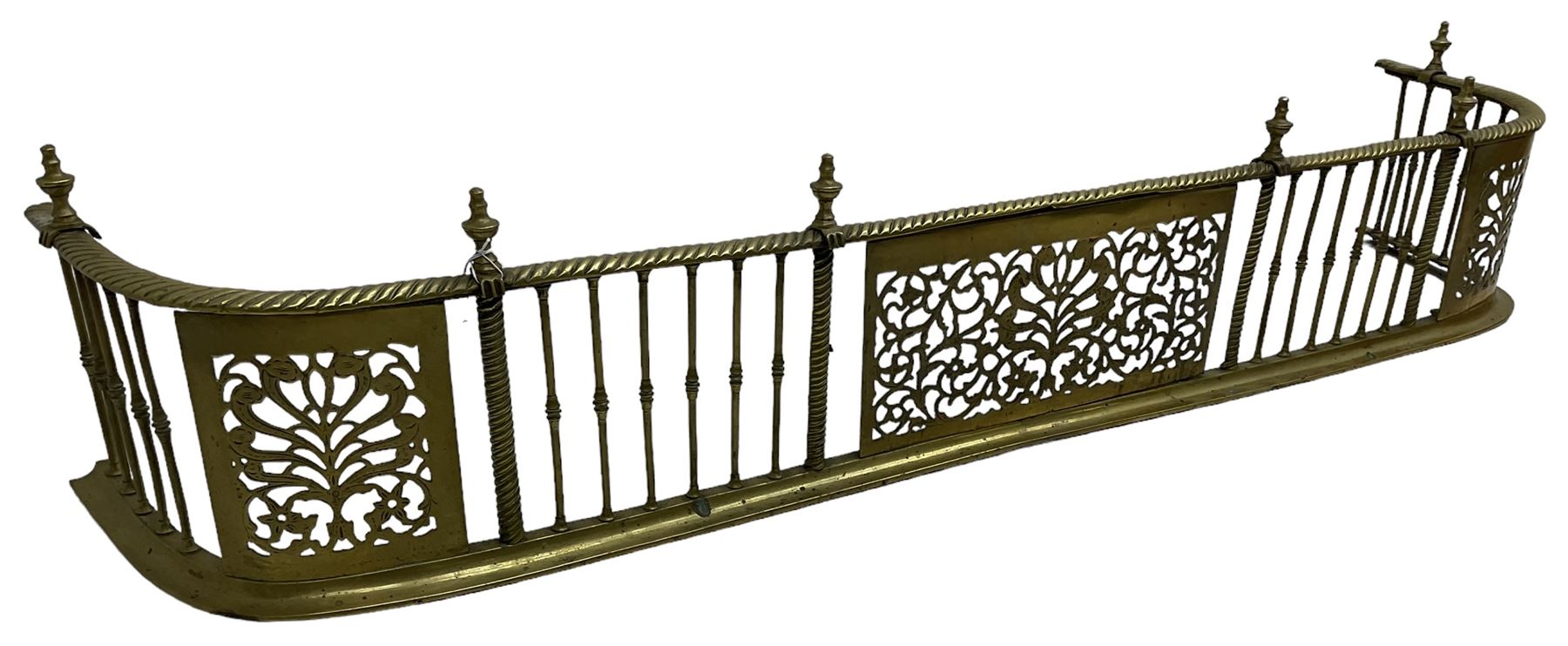 Early 19th century Irish brass D-shaped brass fender, twist borders and balustrade supports, central pierced frieze panel decorated with scrolling foliage and central anthemion motif  